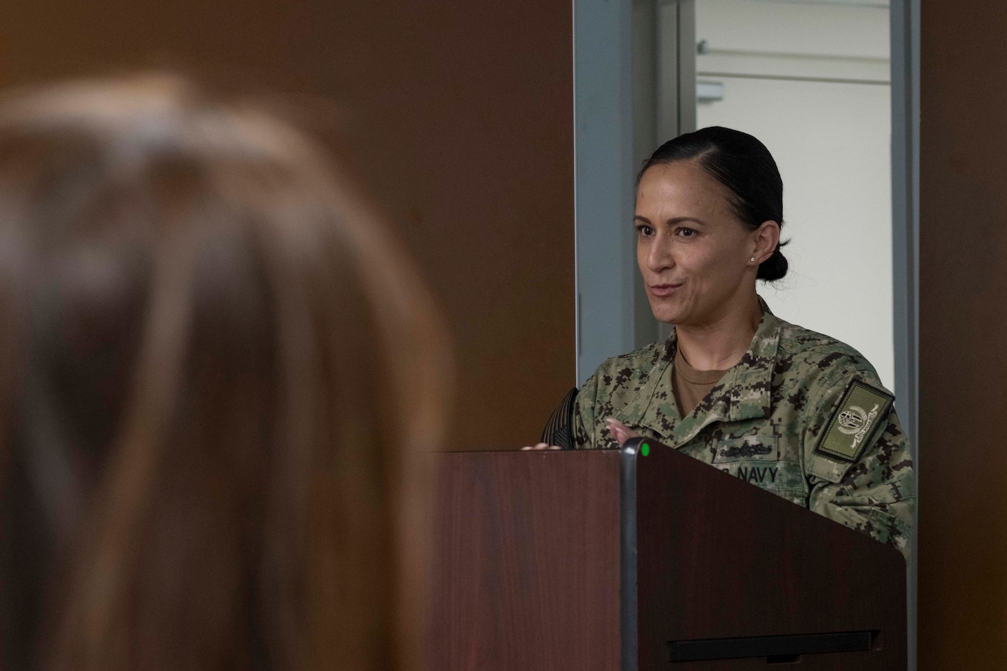 Senior Chief Yeoman Natalie Bedoya, assigned to Naval Support Activity Souda Bay, talks about gender diversity during a Women’s History Month event on March 27, 2024.