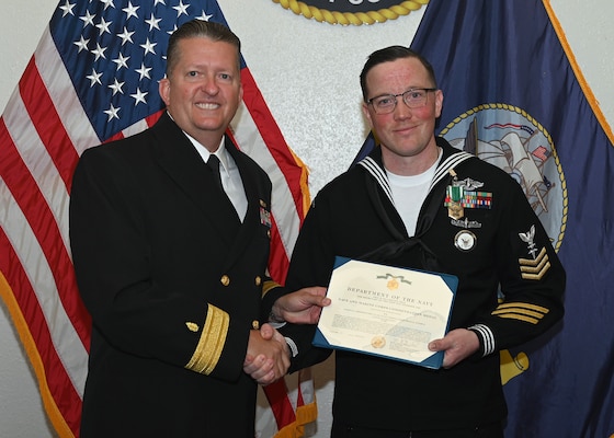 JOINT BASE SAN ANTONIO-FORT SAM HOUSTON – (March 29, 2024) – Hospital Corpsman 1st Class Brian Stemple, of Akron, Ohio, assigned to Naval Medical Leader and Professional Development Command (NMLPDC), was recognized by Rear. Adm. Walter Brafford, commander, Naval Medical Forces Support Command (NMFSC), as NMLFDC’s FY 2023 Sailor of the Year at NMFSC headquarters. NMFSC develops and delivers integrated education and training that produces operational medical experts to project Medical Power in support of Naval Superiority. (U.S. Air Force photo by Taylor Curry, 502 Air Base Wing Public Affairs/Released)