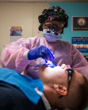 240229-N-TU663-1105 NEWPORT NEWS, Va. (Feb. 29, 2024) - Hospital Corpsman 1st Class Sheena Hunt, a native from St. Louis, performs dental cleaning on Lt. j. g. Vincent Bodnar, from Avon, Ohio, both assigned to the Nimitz-class aircraft carrier USS John C. Stennis (CVN 74), on the floating accommodation facility, in Newport News, Virginia, Feb. 29, 2024. John C. Stennis is in Newport News Shipbuilding conducting Refueling and Complex Overhaul to prepare the ship for the second half of its 50-year service life. (U.S. Navy photo by Mass Communication Specialist 3rd Class Daniel Perez)