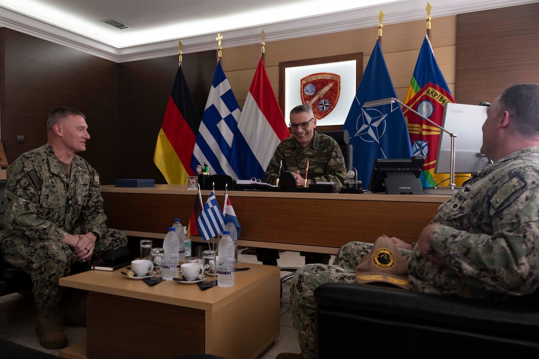 Capt. Odin J. Klug (left) , commanding officer, Naval Support Activity Souda Bay, and Rear Adm. Brad Collins, Commander, Navy Region Europe, Africa, Central, meet with Maj. Gen. Anastasios Dimoulas, commander, NATO Missile Firing Installation (NAMFI), during Collins’ site visit to NSA Souda Bay on March 26, 2024.