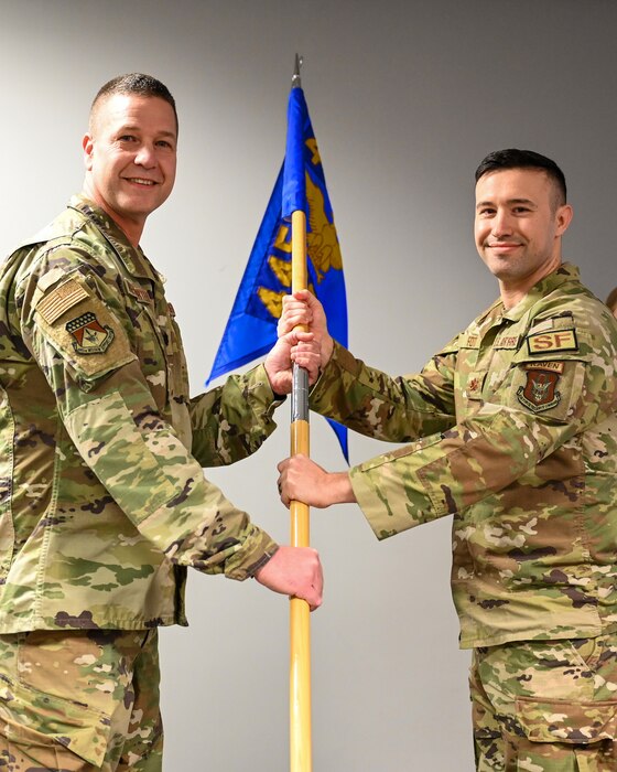Lt. Col. Robert Wengerter, 445th Mission Support Group commander, passes the guidon to Maj. Christopher Foti, incoming 445th Security Forces Squadron commander, during an assumption of command ceremony at Wright-Patterson Air
Force Base, Ohio, March 10, 2024.