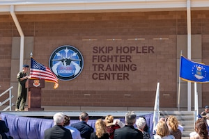 The renaming of the Skip Hopler Fighter Training Center is revealed during a ceremony, March 29, 2024, at Luke Air Force Base, Arizona.