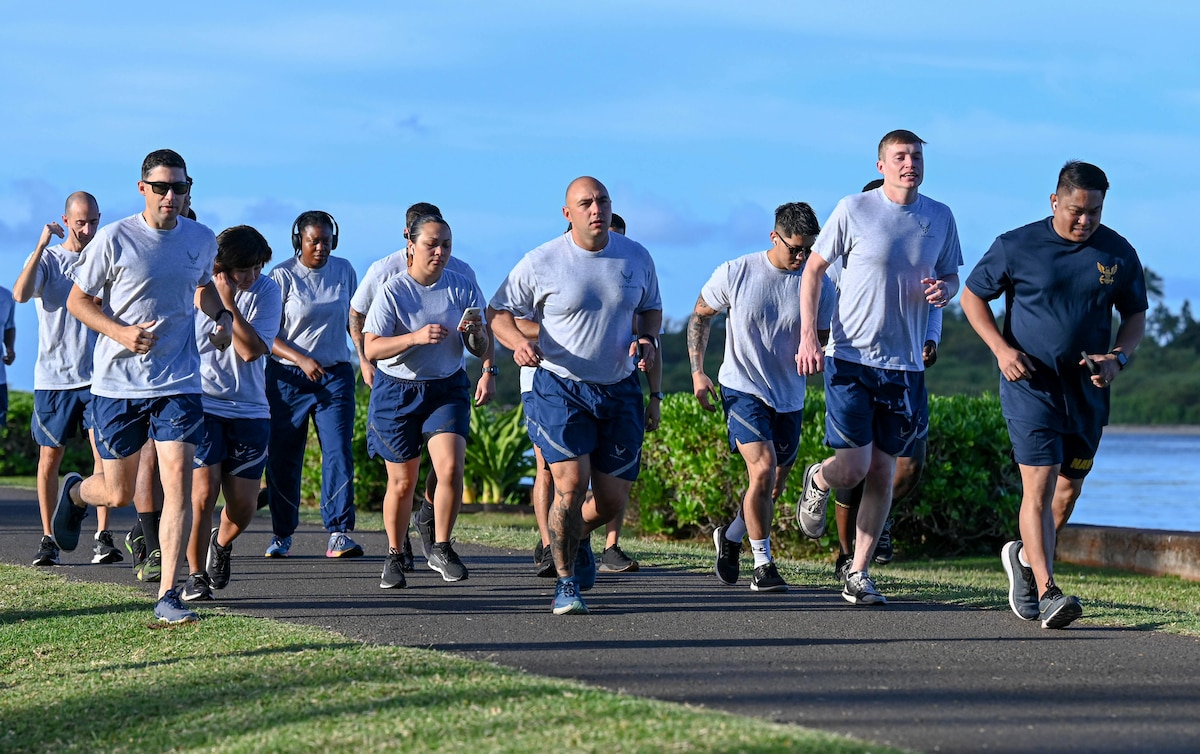 Students attending the Noncommissioned Officer Academy begin a school run at the Binnicker Professional Military Education Center, Joint Base Pearl Harbor-Hickam, Hawaii. Starting May 1, 2024, Airmen attending enlisted professional military education courses lasting 20-days or longer could be sent back to their units for failing to meet physical fitness or uniform standards. (U.S. Air Force photo by 1st Lt. Benjamin Aronson)