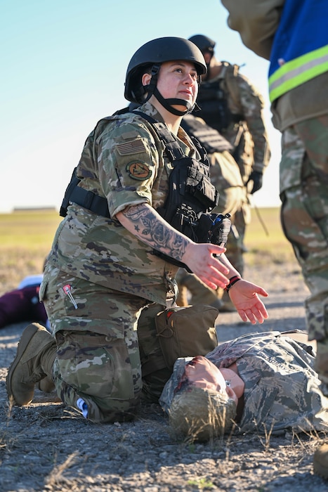 U.S. Air Force Senior Airman Crystal Pezo, 97th Logistics Readiness Squadron supply material control journeyman, performs tactical combat casualty care (TCCC) during the Caduceus Spear exercise at Altus Air Force Base, Oklahoma, March 28, 2024. Participants in the exercise demonstrated TCCC skills in a simulated hostile environment. (U.S. Air Force photo by Airman 1st Class Jonah G. Bliss)