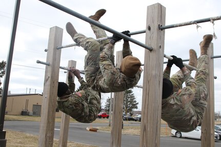 Service members complete heel hooks as part of their final fitness test to receive their Holistic Health and Fitness Integrator (H2F1) additional skill identifier (ASI). Instructors from the 83rd U.S. Army Reserve Readiness Training Command, under the 100th Training Divisions, certified 26 soldiers with the Holistic Health and Fitness Integrator (H2F1) additional skill identifier (ASI).