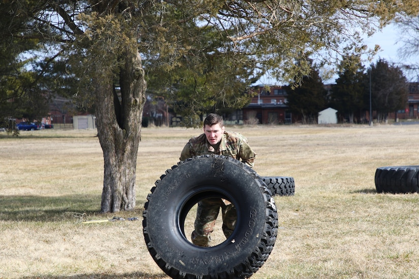 Air Force Staff Sgt. Alex Potts flips a tire 25 feet as part of the final fitness test for the Holistic Health and Fitness Integrator course. Instructors from the 83rd U.S. Army Reserve Readiness Training Command, under the 100th Training Divisions, certified 26 soldiers with the Holistic Health and Fitness Integrator (H2F1) additional skill identifier (ASI).