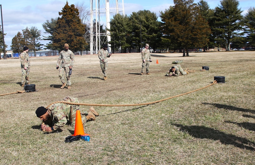 Service members high crawl the length of a rope, then turn around and pull the weighted sled towards them as part of the final fitness test for the Holistic Health and Fitness Integrator course. Instructors from the 83rd U.S. Army Reserve Readiness Training Command, under the 100th Training Divisions, certified 26 soldiers with the Holistic Health and Fitness Integrator (H2F1) additional skill identifier (ASI).