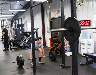 Air Force Staff Sgt. Alex Potts is coached through an hour-long lower body training session. Instructors from the 83rd U.S. Army Reserve Readiness Training Command, under the 100th Training Divisions, certified 26 soldiers with the Holistic Health and Fitness Integrator (H2F1) additional skill identifier (ASI).