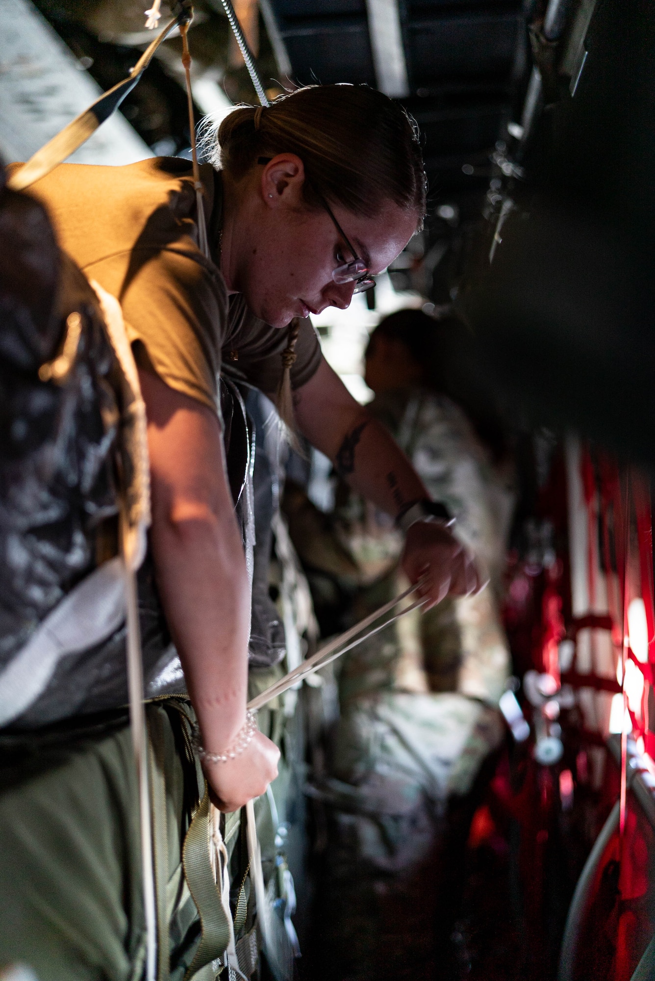 A loadmaster inspects humanitarian aid loaded aboard a C-130J destined for Gaza.