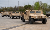 A photo of three Humvees.