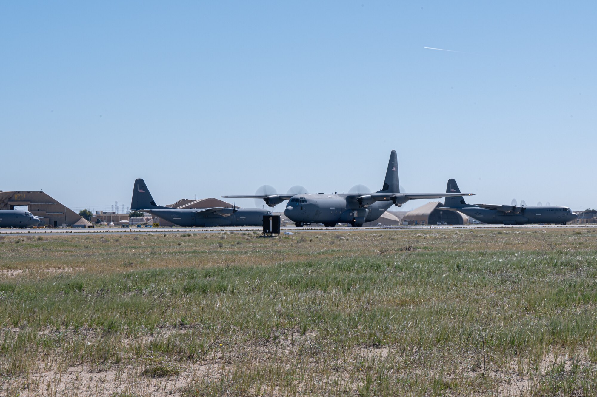 Four C-130 aircraft loaded with humanitarian aid bound for airdrop over Gaza take off.