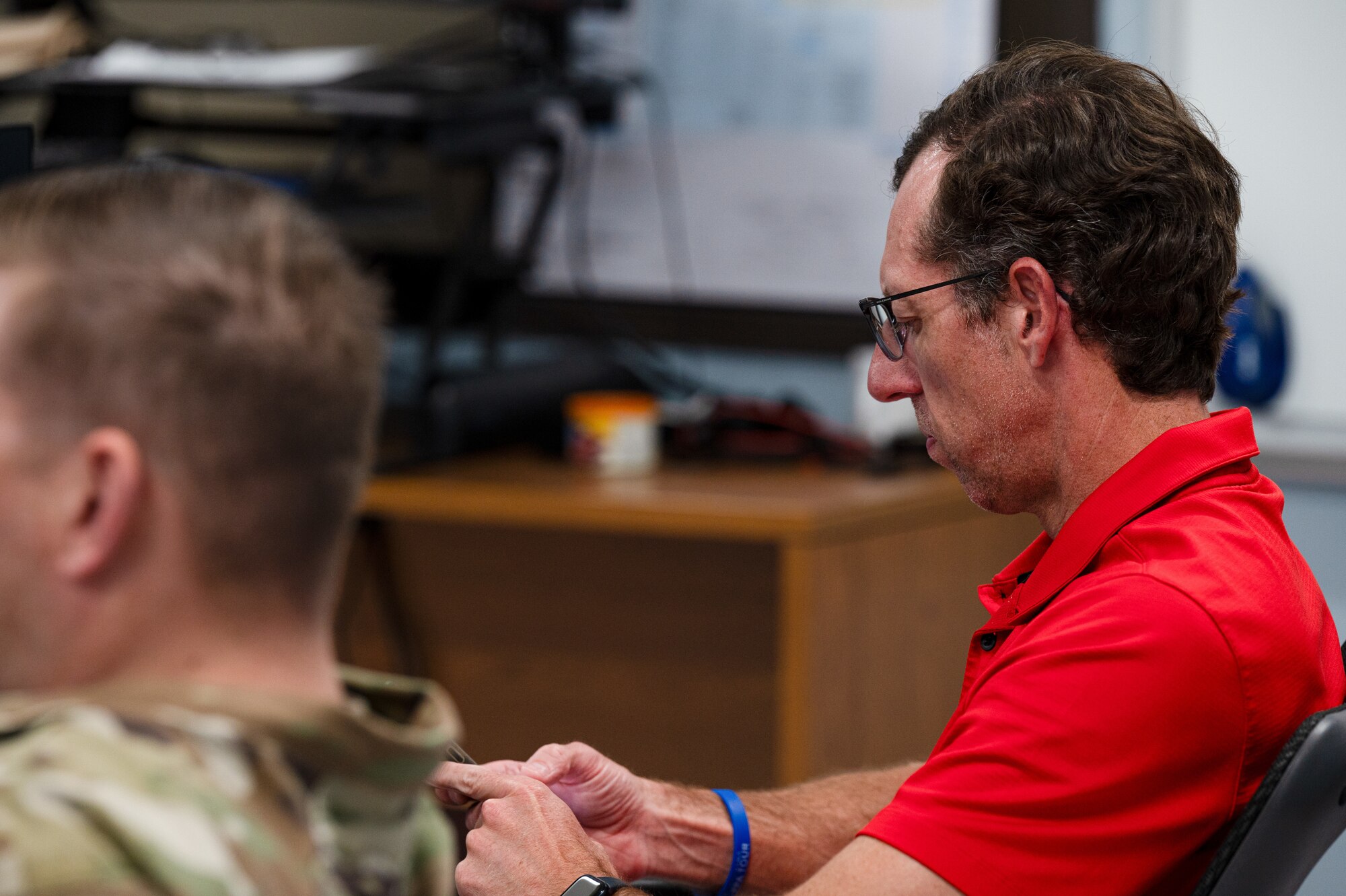 Brad Shonk, Biloxi School District instructional coach, takes notes during the assessment of a 333rd Training Squadron instructor at Keesler Air Force Base, Mississippi, March 18, 2024.