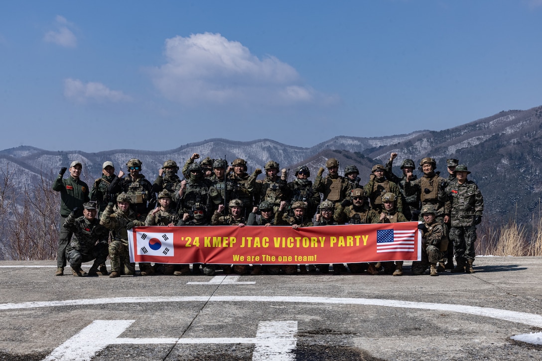 U.S. Marines with 5th Air Naval Gunfire Liaison Company, III Marine Expeditionary Force Information Group, Republic of Korea marines, and U.S. Airmen with 604th Air Support Operations Squadron tactical air control party pose for a photo during a tactical air control party live fire range part of exercise Warrior Shield 24 on Pilsung Range, Gangwan Province, South Korea, March 18-21, 2024. Warrior Shield 24 is an annual joint, combined, exercise in the Republic of Korea that strengthens the combined defensive capabilities of ROK-U.S. Forces. This routine, regularly scheduled, field training exercise provides the ROK-U.S. Marines the opportunity to rehearse combined operations, exchange knowledge, and demonstrate the strength and capability of the ROK-U.S. Alliance. (U.S. Marine Corps photo by Cpl. Stephen Holland)