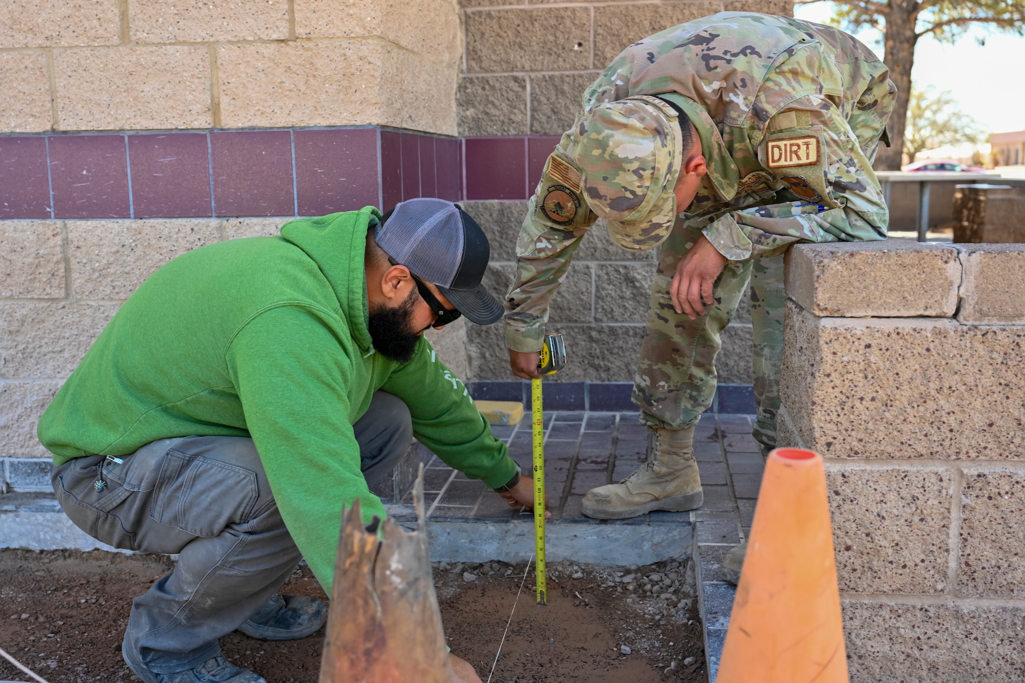 Dirt Boyz Members of the 49th Civil Engineer Squadron, measure a sidewalk for concrete filling at Holloman Air Force Base, New Mexico, March 21, 2024. Members of the Dirt Boyz are responsible for maintaining Holloman’s infrastructure by using various tools to complete construction projects. (U.S. Air Force photo by Airman 1st Class Michelle Ferrari)