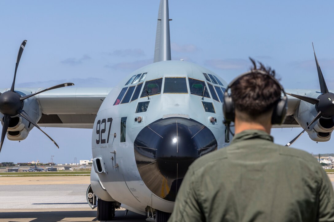 U.S. Marine Corps Cpl. Devon Sanberg, a fixed-wing aircraft crew chief with Marine Aerial Refueler Transport Squadron (VMGR) 152, conducts preflight checks on a KC-130J Super Hercules aircraft at Kadena Air Base, Okinawa, Japan, March 13, 2024. Marines with VMGR-152 refueled U.S. Air Force HH-60G Pave Hawk helicopters while participating in a simulated personnel recovery mission in the Indo-Pacific. Sanberg is a native of Washington. (U.S. Marine Corps photo by Cpl. Chloe Johnson)