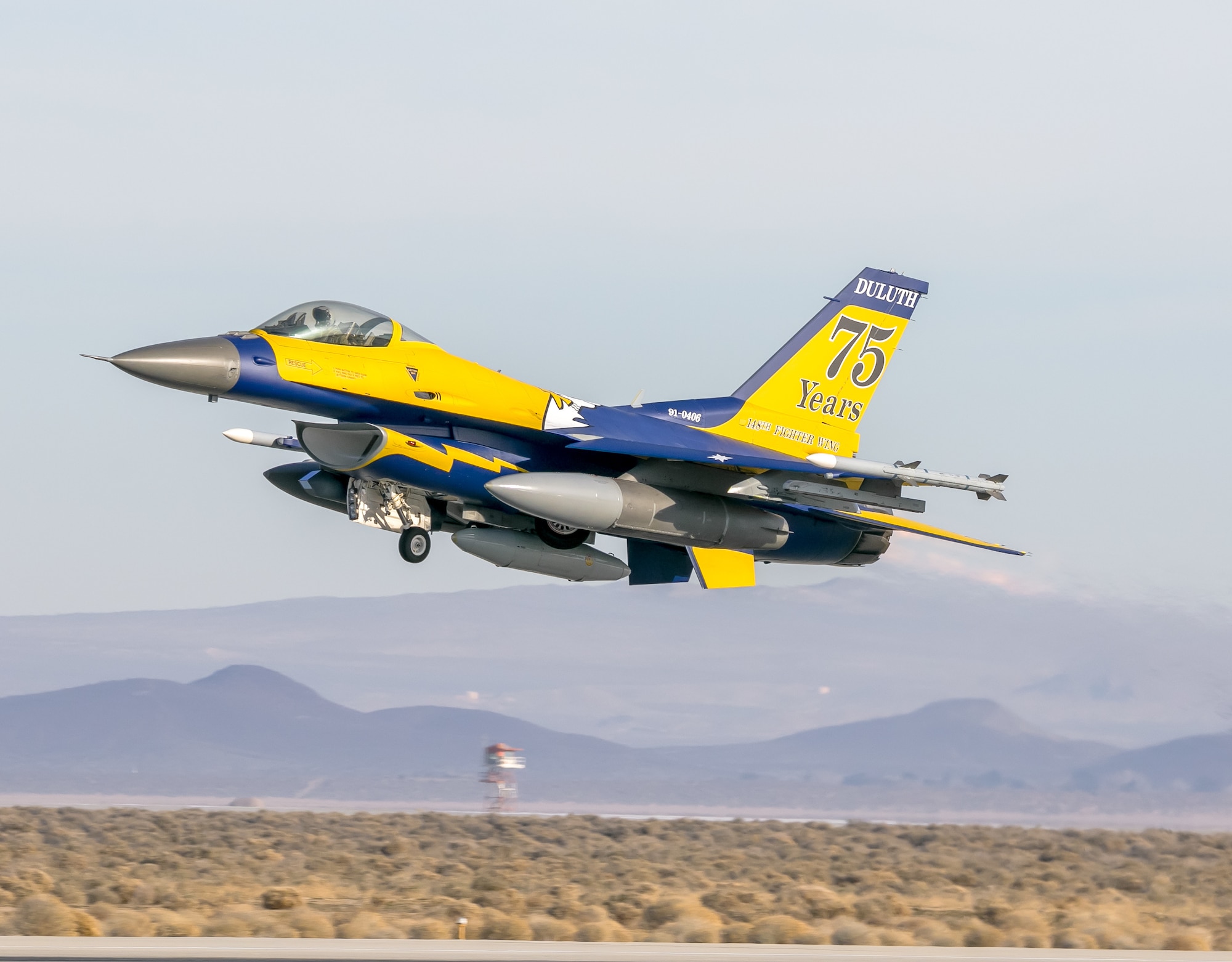 A U.S. Air Force F-16 Fighting Falcon from the 148th Fighter Wing, Duluth, Minn., takes off from Edwards Air Force Base, California, Jan. 26, 2024, after participating in Falcon Rejoin 50. Falcon Rejoin 50 celebrated the 50th Anniversary of the first flight of the F-16 January 20, 1974. (U.S. Air photo by Chase Kohler)