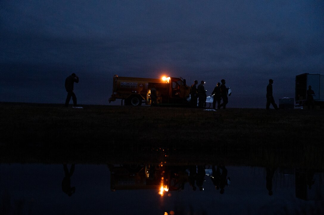 U.S. Marines with explosive ordnance disposal, Headquarters and Headquarters Squadron, Marine Corps Air Station Iwakuni, fill fuel bags to rehearse for the Friendship Day 2024 pyrotechnic display at MCAS Iwakuni, Japan, March 28, 2024. Marines with MCAS Iwakuni EOD conducted training in preparation for Friendship Day in order to quickly and safely set up simulated explosives. (U.S. Marine Corps photo by Lance Cpl. Brian Long)