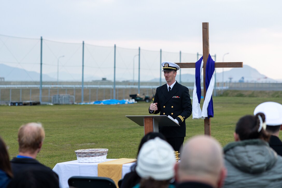 U.S. Navy Lieutenant James Pittman, a chaplain with the Marine Corps Air Station Iwakuni Chapel, and a native of Georgia, welcomes Marines, Sailors, and families to an Easter sunrise service at MCAS Iwakuni, Japan, Mar. 30, 2024.  The service was held by the MCAS Iwakuni Chapel in celebration of the Easter holiday. (U.S. Marine Corps Photo by Cpl. Calah Thompson)