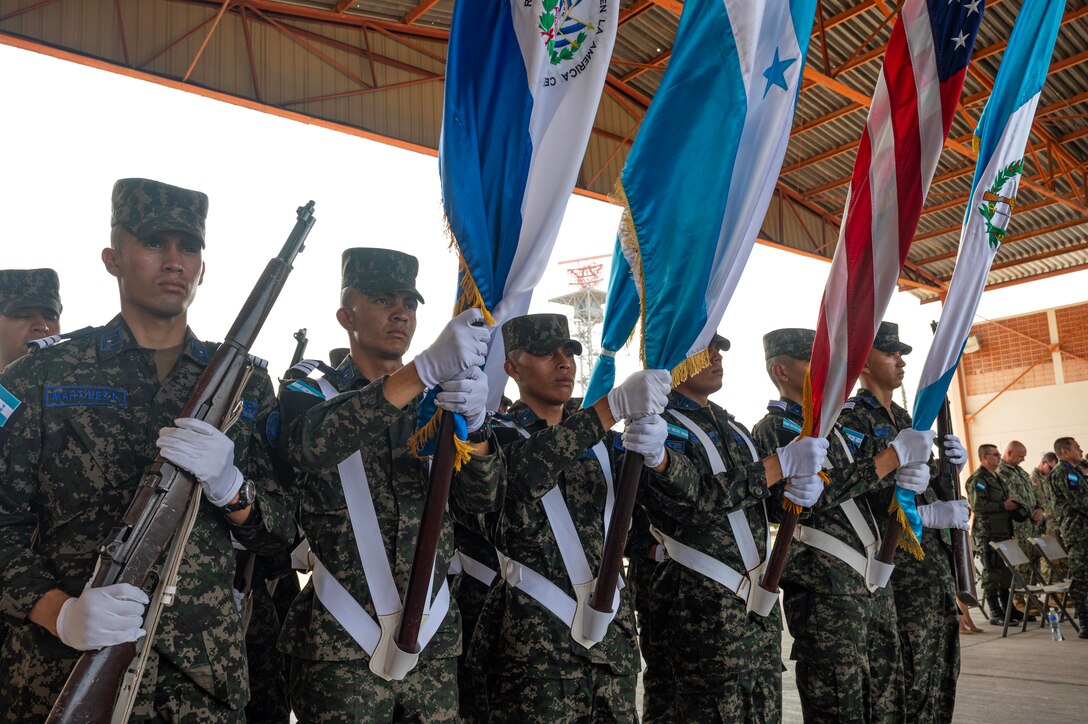 Members of the Honduran military salute during the playing of national anthems during the opening ceremony of CENTAM Guardian 24 phase one at Soto Cano Air Base, Honduras, April 2, 2024.