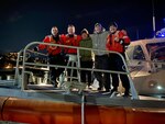 A Coast Guard Station Burlington boat crew rescues two stranded boaters on Lake Champlain after their vessel ran aground