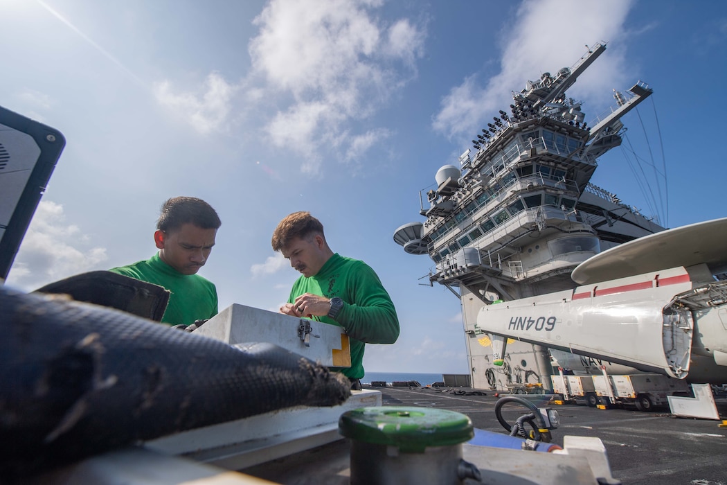 Sailors perform maintenance aboard USS Theodore Roosevelt (CVN 71).
