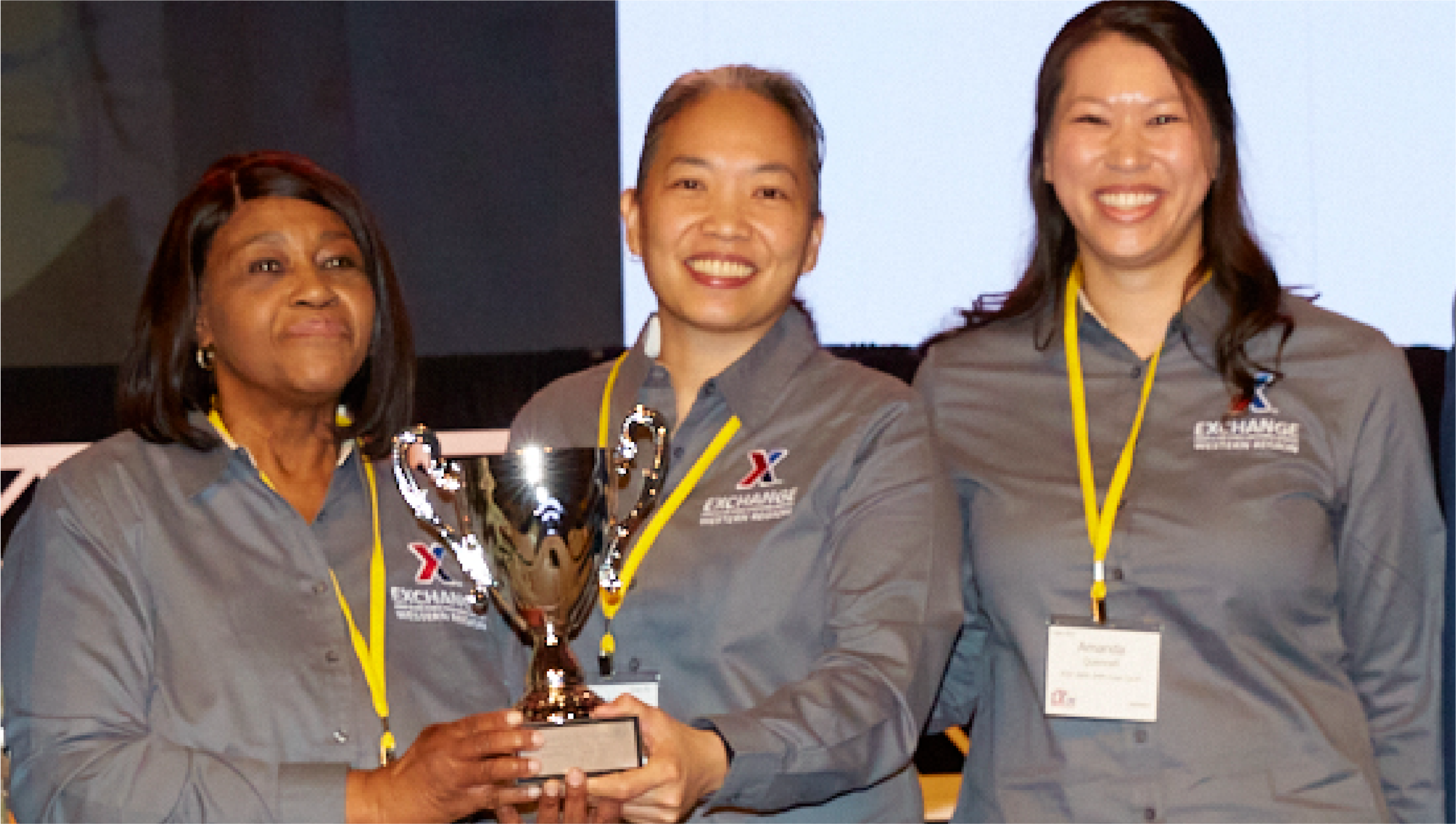 JBER Exchange Main Store Manager Edna Cofield, JBER Exchange General Manager Keola Chan, and JBER Exchange Food Court Manager Amanda Quennell.