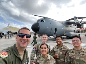 Col. Edward Schierberl, 374th Air Expeditionary Wing commander, and U.S. Air Force Airmen pose for a photo in February 2024, on the flightline at Andersen Air Force Base, Guam, during the Cope North 24 exercise.