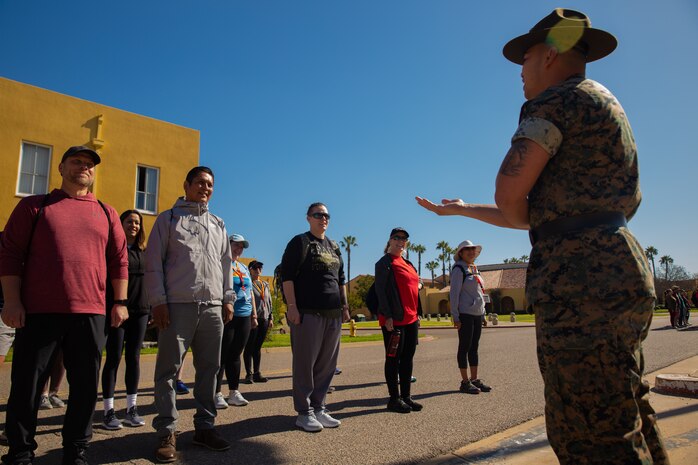 U.S. Marine Corps drill instructor with Support Battalion, Recruit Training Regiment, instructs educators with Recruiting Stations’ Albuquerque, Denver, Houston, and Salt Lake City on close-order drill as part of the 2024 Educator’s Workshop, April 2, 2024 at Marine Corps Recruit Depot San Diego, California. Participants of the workshop visit MCRD San Diego to observe recruit training and gain a better understanding about the transformation from recruits to United States Marines. Educators also received classes and briefs on the benefits that are provided to service members serving in the United States armed services. (U.S. Marine Corps photo by Sgt. Trey Q. Michael)
