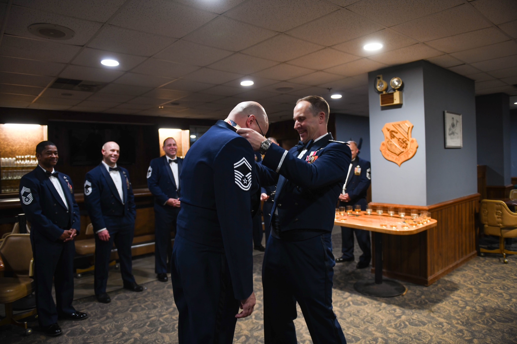 U.S. Air Force Col. Lucas Teel, 4th Fighter Wing commander, places a medallion on Chief Master Sgt. Benjamin Griffin, select, with the 916th Air Refueling Wing, during a chief master sergeant recognition ceremony at Seymour Johnson Air Force Base, North Carolina, March 2, 2024.  Seymour Johnson AFB leadership recognized three senior noncommissioned officers who achieved the final milestone of their rank progression. (U.S. Air Force photo by Senior Airman Taylor Hunter)