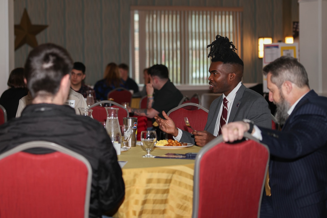 Attendees to the 2024 Wounded Warrior Education, Internship and Career Recourse Fair participate in a networking breakfast at the Clubs of Quantico on Marine Corps Base Quantico, Virginia, March 27, 2024. The resource fair provides Wounded Warriors transitioning out of the military, various connections and opportunities to help them in future endeavors. (U.S. Marine Corps photo by Lance Cpl. David Brandes)