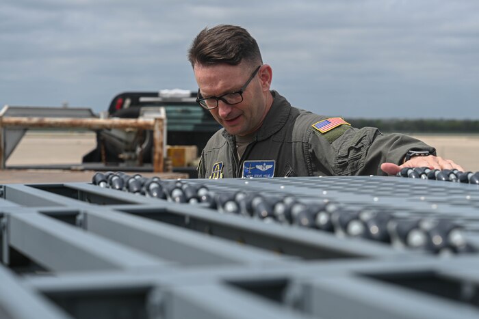 An Airman looks at a prototype loader