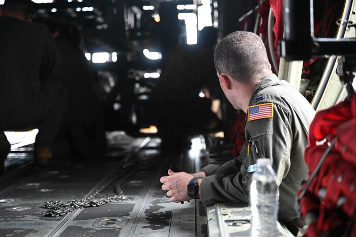 An Airman looks inside an aircraft