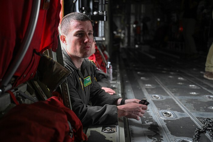 An Airman looks inside an aircraft