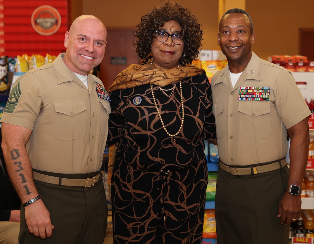 U.S. Marine Corps Sgt. Maj. Michael R. Brown, the sergeant major of Marine Corps Base Quantico, left, U.S. Army veteran Dr. Annie L. McNeil, center, and Col. Michael L. Brooks, base commander of MCBQ, right, stand together during the Vietnam Veterans Day Ceremony at the Quantico Commissary on MCBQ, Virginia, March 29, 2024. The Defense Commissary Agency partnered with The United States of America Vietnam War Commemoration to thank and honor Vietnam veterans and their families for their service and sacrifice on behalf of the nation. (U.S. Marine Corps photo by Lance Cpl. David Brandes)