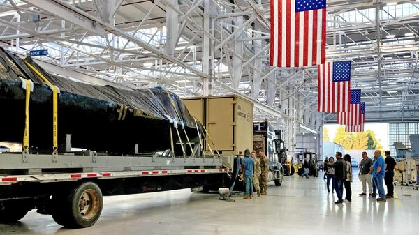 An F-16 awaits to be unveiled and serviced at FRCSW.