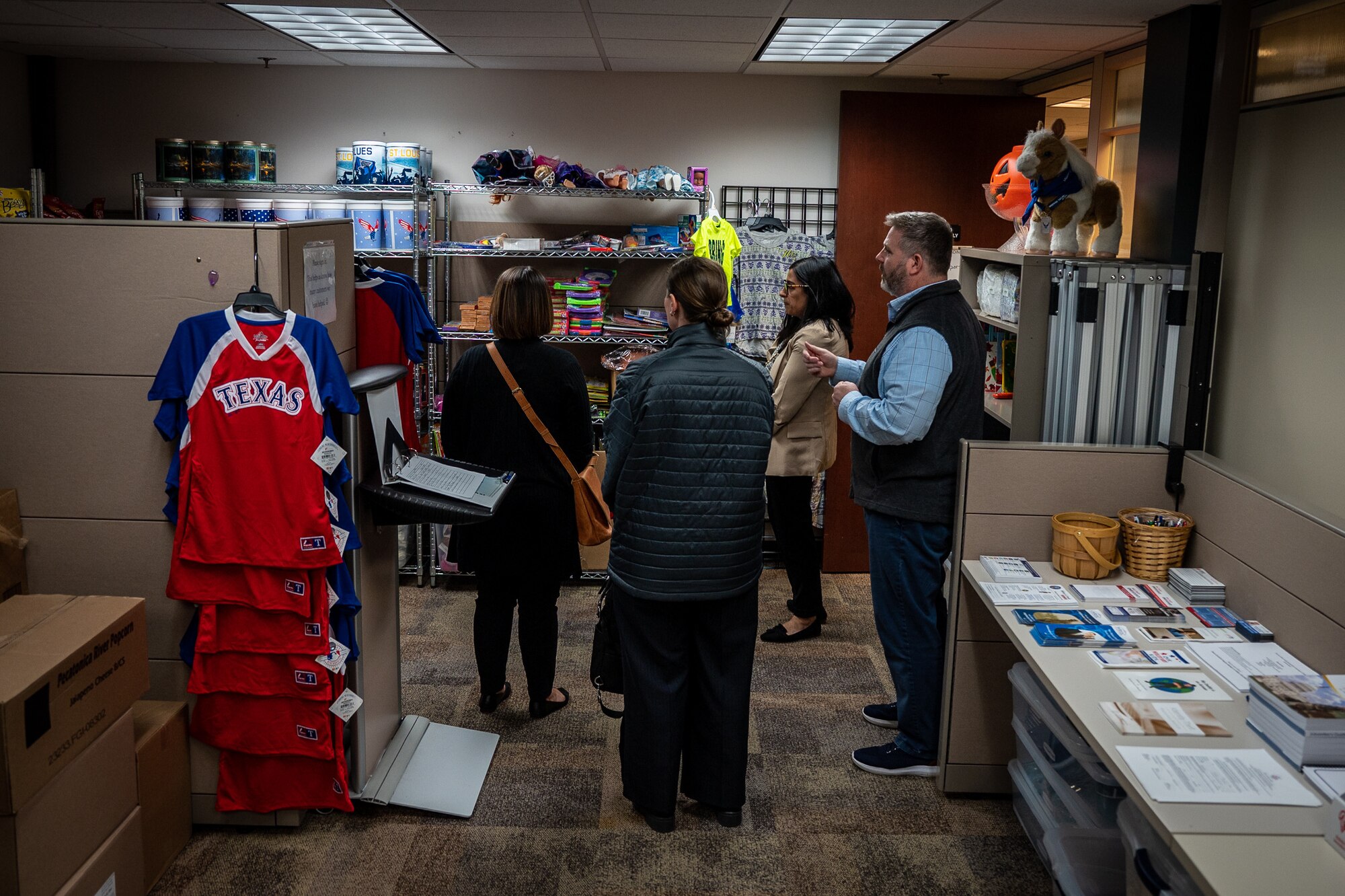 Rebecca Parkes, USO Regional President, Amanda Schmidt, USO Missouri Executive Director, and Megan Kidd, USO Missouri Field Program Specialist, get a tour of the Military and Family Readiness area from Christopher “CJ” Johnson, 932nd Force Support Squadron, Military and Family Readiness program manager during an initial visit to the 932nd AW, March 26, 2024, Scott Air Force  (U.S. Air Force photo by Christopher Parr)