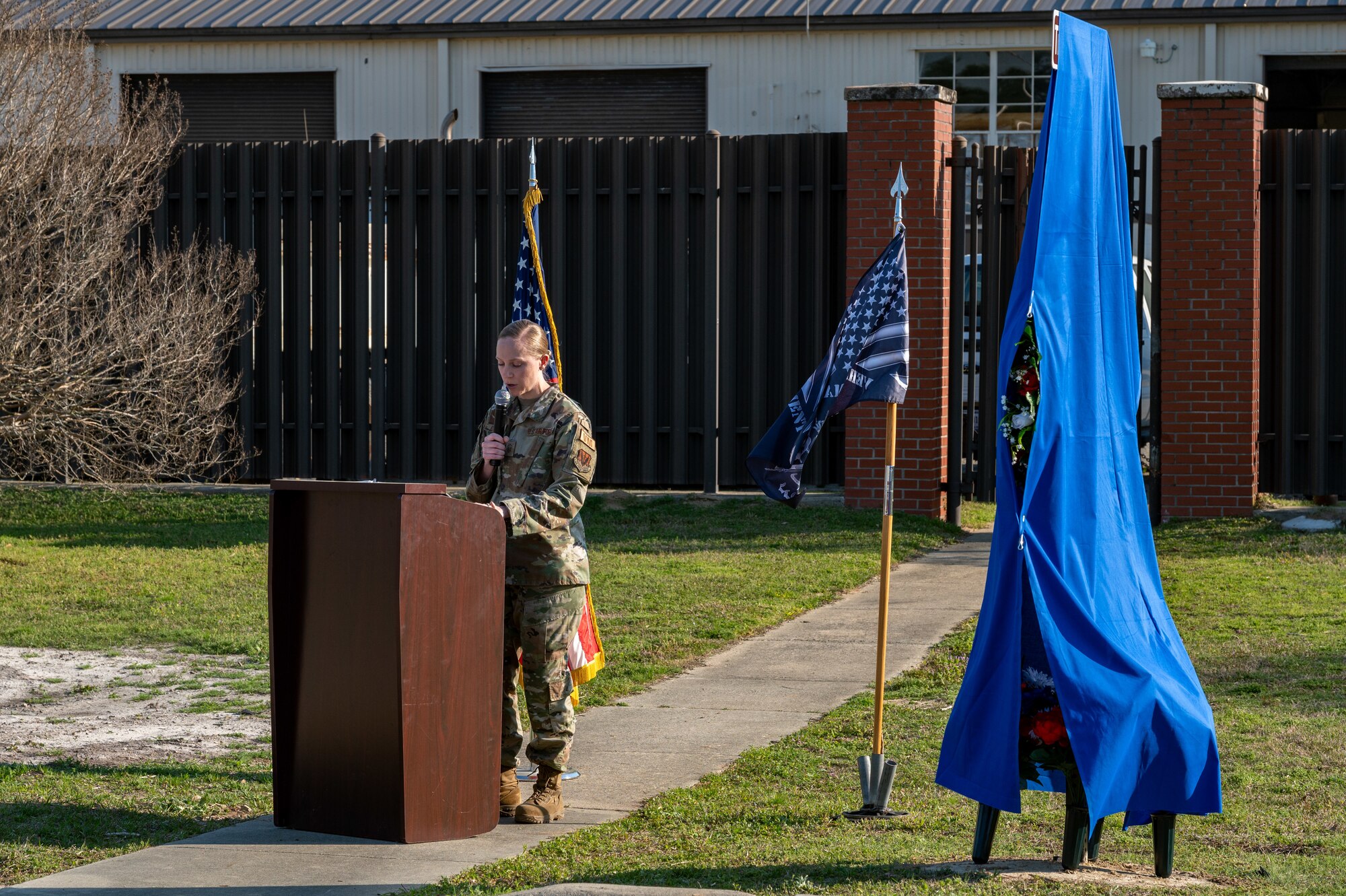 U.S. Air Force Master Sgt. Tammy Reflogal, Vehicle Management flight chief, speaks during a fallen airman memorial ceremony at Seymour Johnson Air Force Base, North Carolina, March 15, 2024. For his sacrifice Staff Sgt. Timothy Bowles was posthumously awarded the Purple Heart and Bronze Star. (U.S. Air Force photo by Airman 1st Class Leighton Lucero)