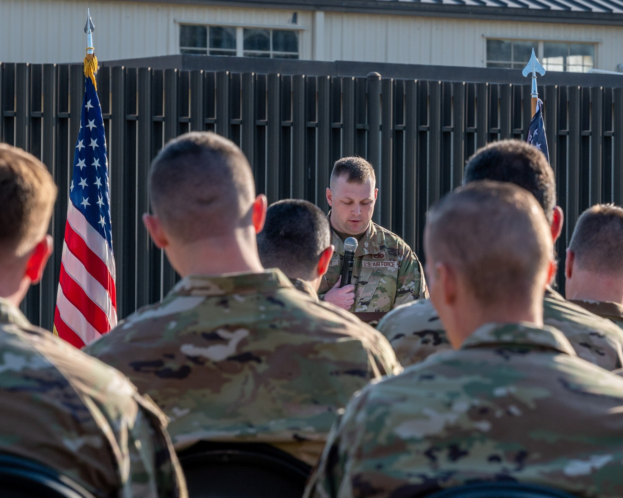 U.S. Air Force Tech. Sgt. Matthew Wagner, 4th Fighter Wing inspection team manager, speaks during a fallen airman memorial ceremony at Seymour Johnson Air Force Base, North Carolina, March 15, 2024. For his sacrifice Staff Sgt. Timothy Bowles was posthumously awarded the Purple Heart and Bronze Star. (U.S. Air Force photo by Airman 1st Class Leighton Lucero)
