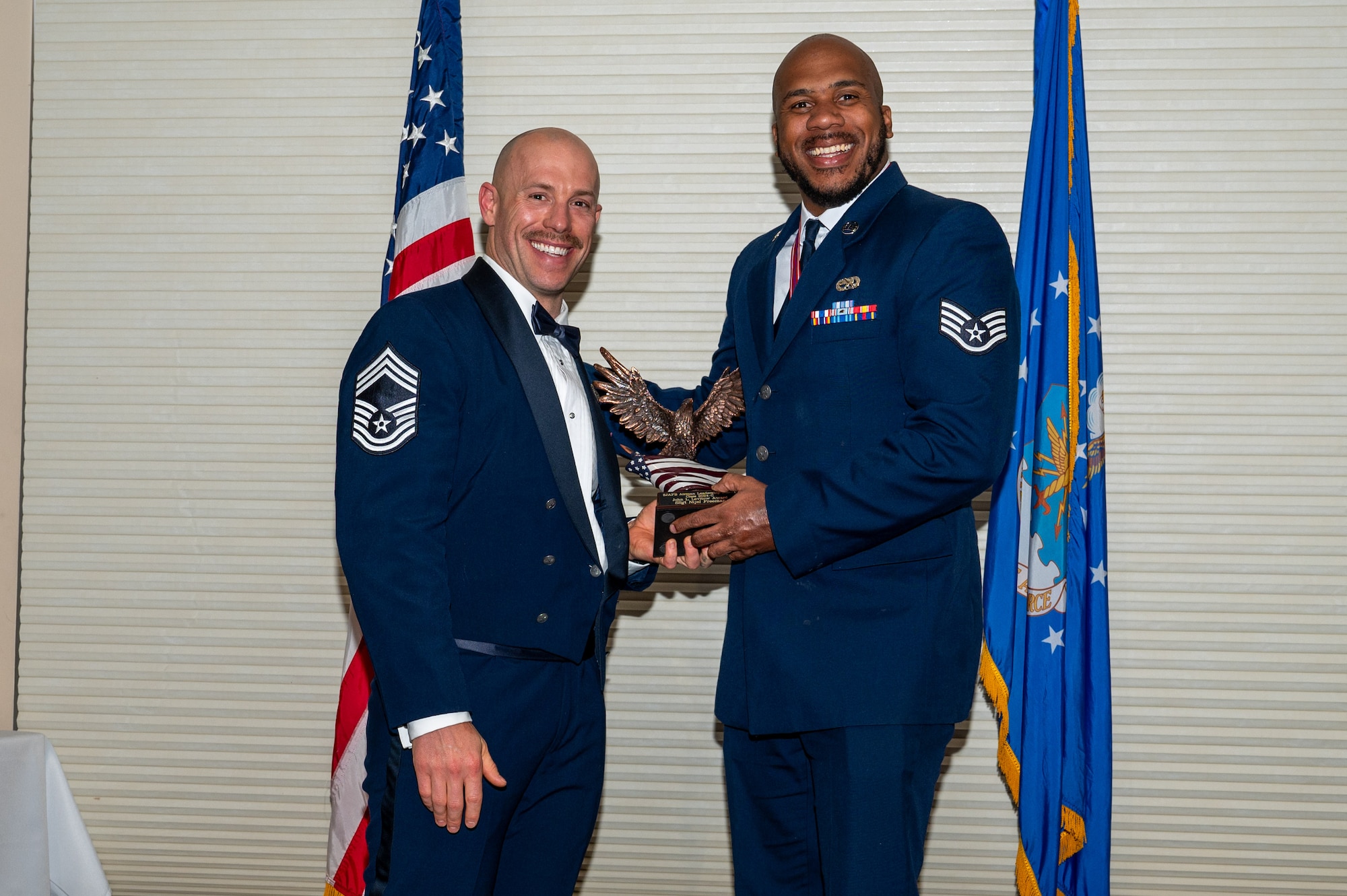 Staff Sgt. Nijel Freeman, assigned to the 4th Component Maintenance Squadron, right, receives the John L. Levitow Award from Chief Master Sgt. Austin Sutton, 4th Operations Support Squadron senior enlisted leader, during the Airman Leadership School class 24-C graduation ceremony at Seymour Johnson Air Force Base, North Carolina, Mar. 20, 2024. The John L. Levitow Award is the highest honor that can be earned by an Enlisted Professional Military Education graduate. (U.S. Air Force photo by Airman Rebecca Tierney)
