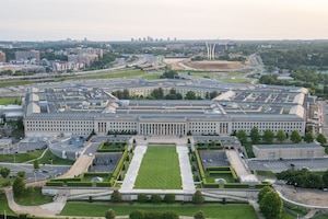 five-sided building is photographed from above.