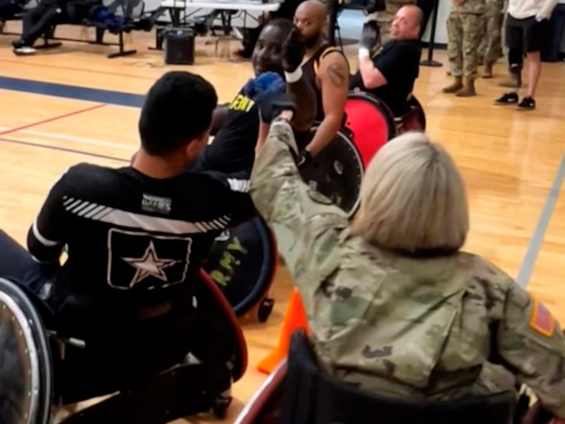 Army Surgeon General Lt. Gen. Mary Izaguirre Hi-fives Team Army Soldiers after a few drills during the 2024 Army Trials