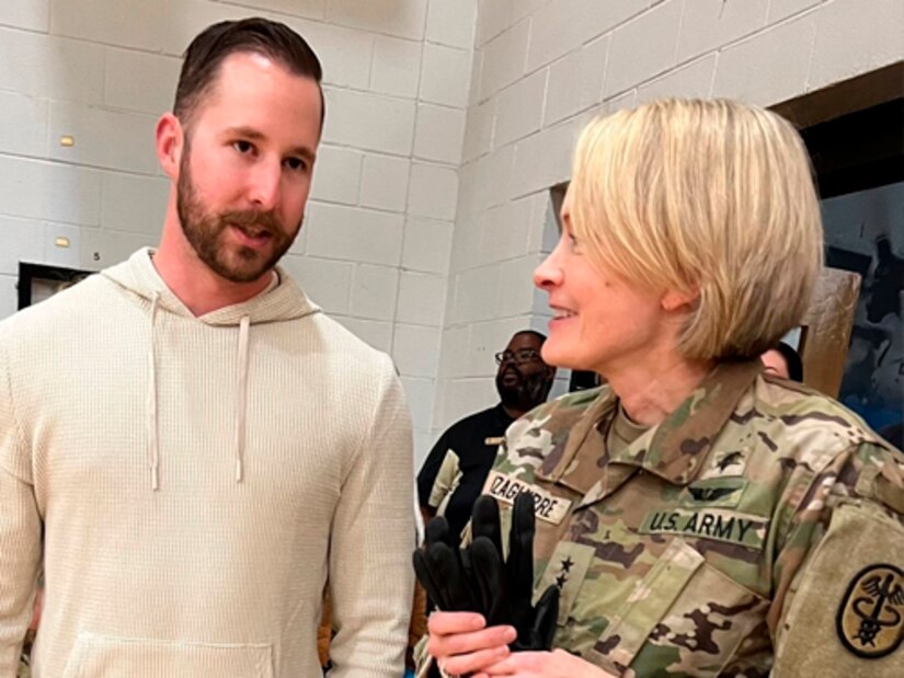 U.S. Army veteran Cpl. Patrick Dayton, left, and Lt. Gen. Mary Izaguirre talk about adaptive sports and Army Trials