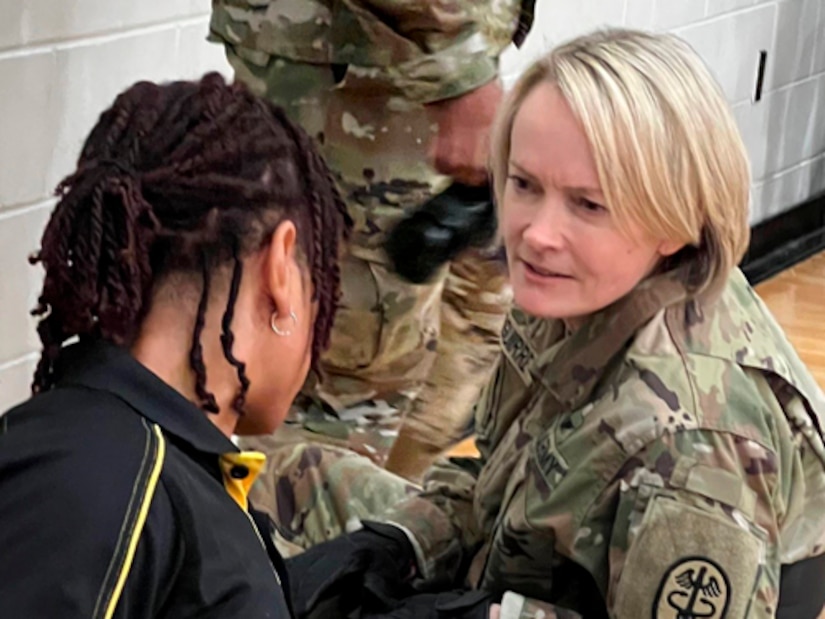 Army Surgeon General Lt. Gen. Mary Izaguirre chats with Retired Army Staff Sgt. Lavone Kendrick at wheelchair rugby competition during the 2024 Army Trials