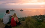 Hikers watch the sunrise over Lanikai Beach from the Kaiwa Ridge Trail on Oahu in 2016. The Coast Guard wants members to be able to take advantage of all their leave to refresh and recharge. (Photo by: U.S. Navy Mass Communication Specialist 1st Class Rebecca Wolfbrandt)