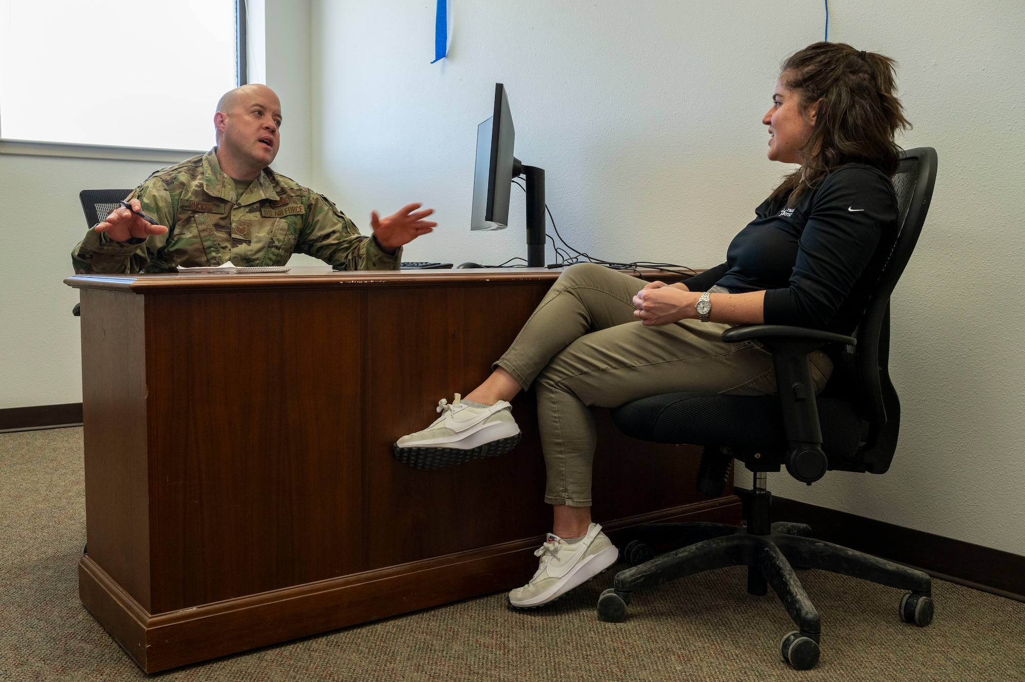 U.S. Air Force Tech. Sgt. Dustin Rucker, 49th Wing foreign object debris–or FOD– monitor, left, talks to Nicole Roccaforte, Polymath Robotics representative, about the importance of FOD clearing on the runways and taxiways at Holloman Air Force Base, New Mexico, March 20, 2024.