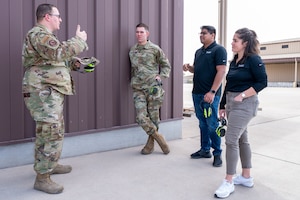 U.S. Air Force Tech. Sgt. Dwane Parmelee, 49th Maintenance Group Section 49 noncommissioned officer in charge, left, speaks to U.S. Air Force Kristopher Molter, 49th MXG Section 49 mentor, center left, as well as Nicole Roccaforte and Naveen Kulandaivelu, Polymath Robotics representatives, about the process of a foreign object debris–or FOD– walk at Holloman Air Force Base, New Mexico, March 20, 2024.