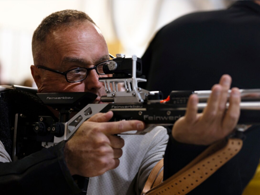 U.S. Army veteran Chief Warrant Officer 5 Richard (Bruce) McCormick stares down his target during the shooting event at the 2024 Army Trials