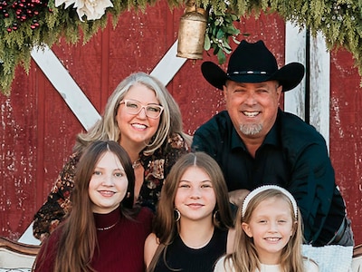 Retired Chief Warrant Officer 5 Bruce McCormick with his wife and three younger daughters.