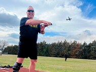 A flyover in honor of retired Army pilot Chief Warrant Officer 5 Richard (Bruce) McCormick, competing in discus at the 2024 Army Trials