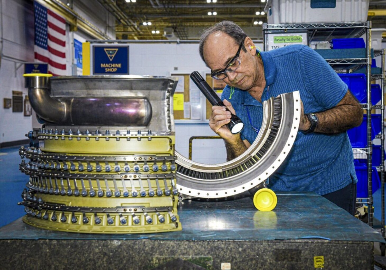 Quality Assurance Specialist Hugo Rodriguez performs a final inspection prior to reassembling an F414 High Pressure Compressor Stator (HPC) at Fleet Readiness Center Southeast. The F414 engine powers the Navy's F/A-18E/F Super Hornet and EA-18G Growler aircraft.